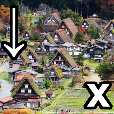 an arrow pointing towards the bottom, a bunch of houses, and an x