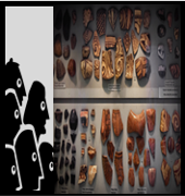 A silhouette of many faces intently looking at a collection of items in a museum exhibit